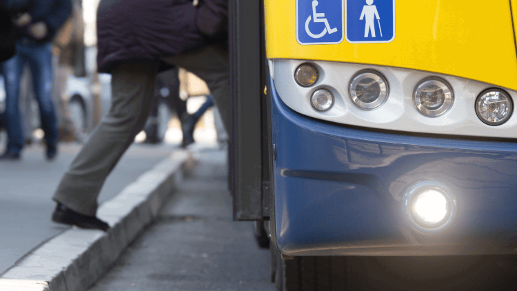 Universal basic services: road to a just transition Man getting on bus