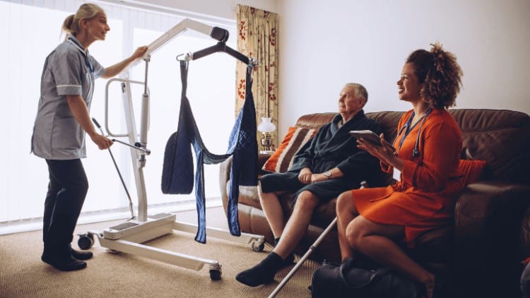 Women at work: doing different jobs, still unequal homecarers with elderly client and hoist