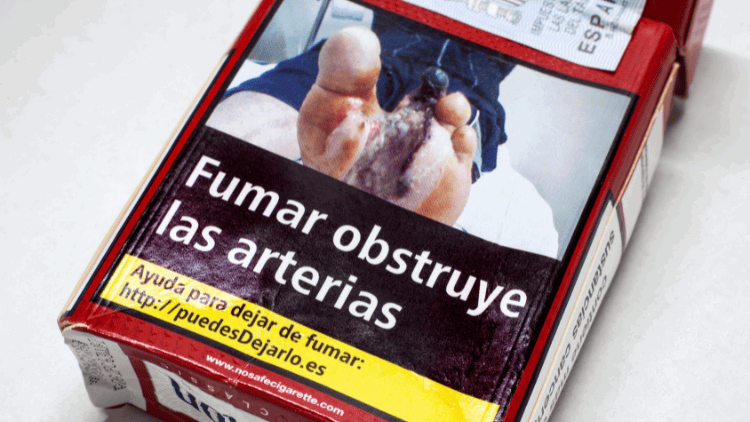 Protecting EU health policy from tobacco lobbying cigarette packet with health warning: 'Smoking obstructs the arteries'