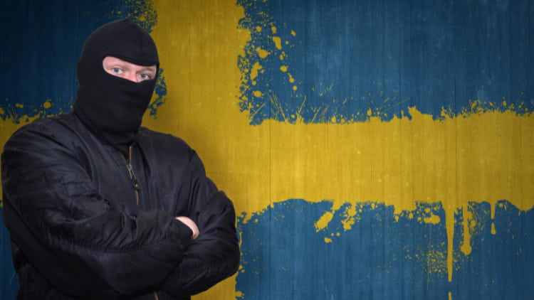 Can a divided EU woo diverse emerging powers? Man in balaclava against backdrop of Swedish flag