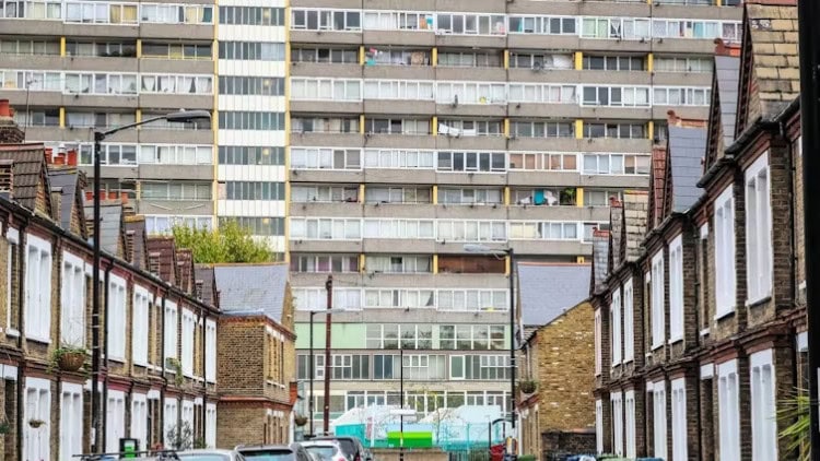 The destitution that sets the UK apart from Europe Multi-storey block of flats seen from old terraced street