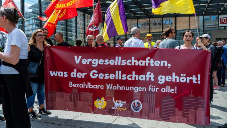 Social Europe against all odds—but is it enough? Protest in Berlin behind banner calling for affordable housing for all