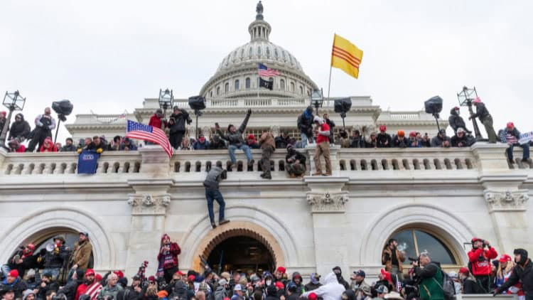 Trump and the darkness threatening US politics Rioting crowd clambering up Capitol building