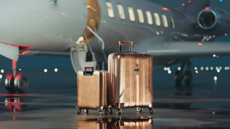 After the Laffer curve: taxing the rich, at last golden suitcases next to private jet