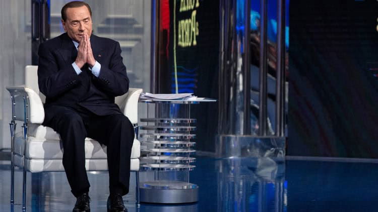 At Italy’s dark heart: the weak rule of law Man in suit in media studio