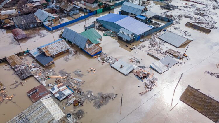Reclaiming time from its tyranny houses submerged by flood water