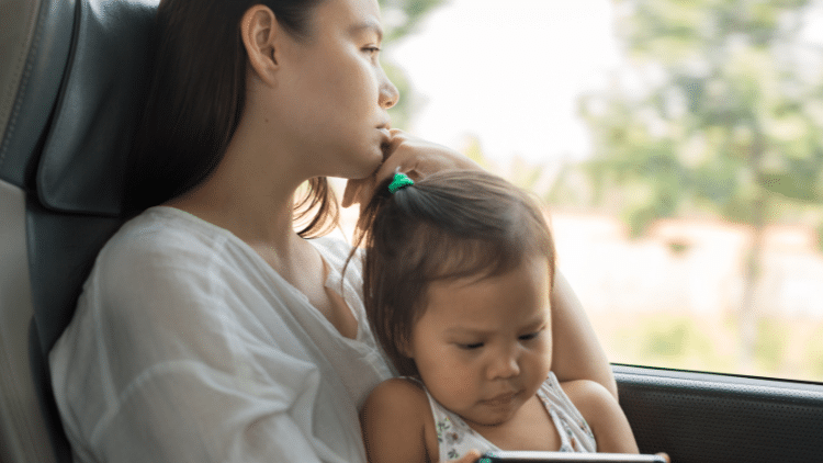 Enhancing gender equality to counter the backlash Stressed woman with child on bus